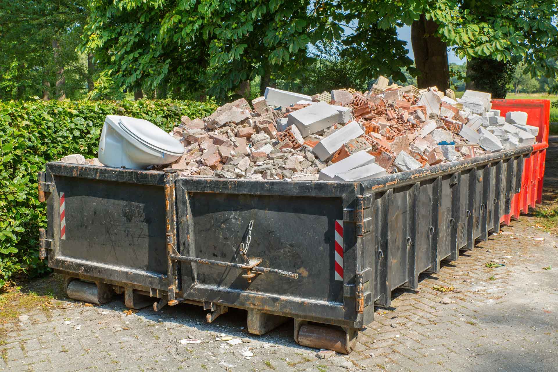 Dumpster full of bricks
